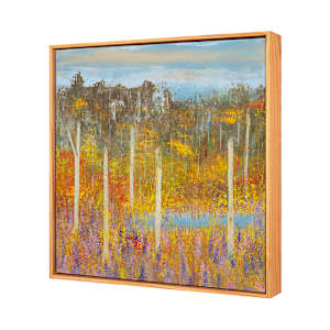 "Out My Back Door" by Steven McHugh  Image: Side view of "Out My Back Door, this artwork is a vibrant landscape painting that showcases a densely wooded area. Tall, slender trees with pale trunks stand prominently in the foreground, their branches interspersed with spring foliage in rich shades of yellow, gold, and red (maple blossoms). The ground below is a colorful mix of purples and pinks (Lupines), and greens (new growth), suggesting a field of wildflowers and dense undergrowth. In the midground, a body of water reflecting the bright colors surrounds the trees, adding depth and contrast to the scene. The background features a darker, more muted forest line under a soft blue sky with light, wispy clouds. The overall composition evokes the serene beauty and tranquility of a forest during the fall season, rendered in a richly textured, impressionistic style.

Inspired by the natural beauty of Madeline Island, "Out My Back Door" embodies the serene and ever-changing landscapes of the Apostle Islands in Lake Superior, WI. This mixed-media  abstract piece is a testament to the artist's unique vision and skill, capturing the essence of the island's raw beauty. It offers a glimpse into a world where imagination meets reality, providing a captivating addition to any art collection. Discover the harmony of colors and textures that reflect the artist's surroundings. Experience the artistry that transforms nature's elements into a visual feast for the senses.

This oil and cold-wax painting on wood panel measures 18.75" x 18.75" x 2.5" natural wood varnished gallery floating frame.  Shipping is included with purchase in the U.S.
