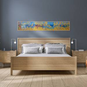 "Big Bay Road" by Steven McHugh  Image: Interior installation view of "Big Bay Road,"  a panoramic landscape painting featuring a dense forest composed of tall, slender trees with white trunks and autumnal foliage in vibrant shades of gold, orange, and yellow. The trees create vertical lines that contrast against a deep blue background suggesting a clear sky and distant water. The composition balances the bright, warm colors of the leaves with the cool blue tones, creating a striking visual effect. The scene conveys a serene atmosphere with an abstract, almost impressionistic style, emphasizing color and form over detailed realism.

Immerse yourself in the essence of Madeline Island with "Big Bay Road," a mixed-media abstract piece crafted by Madeline Island's resident abstract painter, Steve McHugh. This evocative artwork captures the untamed spirit of the Apostle Islands, bringing the ethereal beauty of Lake Superior to your space. Each brushstroke and texture uniquely conveys a non-representational journey through the island's rugged landscapes. Perfect for art enthusiasts seeking a vibrant, dynamic accent for their home or office, "Big Bay Road" embodies the rich, scenic splendor of Wisconsin's northern wilderness. Transform your interior with this compelling piece that resonates deeply with the natural world.

This oil and cold-wax painting is on a wood panel and measures 12 x 72" x 1.5", framed in a gallery floating frame measures 13" x 73" x 2.5". Shipping is included in the lower 48 U.S. states.