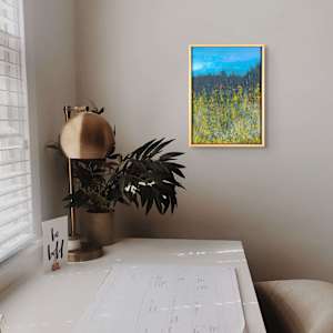"Border" by Steven McHugh  Image: Interior installation view of "Border," a vibrant landscape painting featuring a dense field of yellow wildflowers in the foreground, blending with green and blue hues that suggest lush vegetation. Behind the field, a dark, shadowy treeline stretches horizontally across the canvas, creating a strong contrast against the bright blue sky above. The sky is painted with smooth brushstrokes, introducing a sense of calmness. The overall composition balances bright, vivid colors with darker, muted tones, evoking a natural, serene outdoor scene. The texture and layering of paint give depth and complexity to the natural elements depicted.

Explore the vivid and dynamic essence of "Border" through the unique lens of my mixed-media,  abstract paintings. Nestled in the raw beauty of Madeline Island in the Apostle Islands, Lake Superior, WI, my work captures the intangible emotions and memories of this enchanting locale. Each piece invites you to transcend traditional boundaries and immerse yourself in a world where colors, textures, and forms converge to evoke profound responses. Experience art that goes beyond mere representation and connects deeply with your inner landscape.

This small oil and cold-wax painting is on a wood panel measuring 13.5" x 9.5" x 1.5" and is framed in a gallery floating frame measuring 14.25" x 10.25" x 2.5". Shipping is included in the U.S.