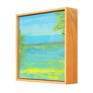 "Tranquil" by Steven McHugh  Image: Side view of "Tranquil," a mesmerizing piece crafted by mixed-media artist from Madeline Island. Reflecting the ethereal charm of the Apostle Islands in Lake Superior, this representational abstract painting embodies a unique harmony that invites calm and introspection. At stevemchugh.art, our dedication to creating emotionally resonant art is evident, and "Tranquil" stands as a testament to our commitment to quality and vision. Elevate your space with this captivating work that seamlessly blends textures and colors to evoke a sense of peaceful surrender. 

"Tranquil" is a serene landscape painting depicting a calm body of water surrounded by greenery. The water reflects varying shades of blue and green, creating a tranquil effect. On both the left and right edges of the scene, dense clusters of green foliage frame the water. The sky above is painted in soft blue hues with subtle hints of light clouds, adding depth to the composition. The overall color palette emphasizes cool tones with touches of warm yellow near the water’s edge. The painting is enclosed in a simple wooden frame that complements the natural theme of the artwork.

This oil and cold-wax painting on wood is framed in a 10.5" x 10.5" x 2.5" gallery floating frame.
