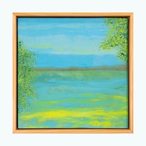 "Tranquil" by Steven McHugh  Image: Step into a world of serene beauty with "Tranquil," a mesmerizing piece crafted by mixed-media artist from Madeline Island. Reflecting the ethereal charm of the Apostle Islands in Lake Superior, this representational abstract painting embodies a unique harmony that invites calm and introspection. At stevemchugh.art, our dedication to creating emotionally resonant art is evident, and "Tranquil" stands as a testament to our commitment to quality and vision. Elevate your space with this captivating work that seamlessly blends textures and colors to evoke a sense of peaceful surrender. 

"Tranquil" is a serene landscape painting depicting a calm body of water surrounded by greenery. The water reflects varying shades of blue and green, creating a tranquil effect. On both the left and right edges of the scene, dense clusters of green foliage frame the water. The sky above is painted in soft blue hues with subtle hints of light clouds, adding depth to the composition. The overall color palette emphasizes cool tones with touches of warm yellow near the water’s edge. The painting is enclosed in a simple wooden frame that complements the natural theme of the artwork.

This oil and cold-wax painting on wood is framed in a 10.5" x 10.5" x 2.5" gallery floating frame.