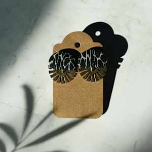 Black Marble Semicircle Post with Gold Burst by Breanna Cole, Image 1.