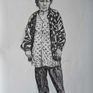 "Sometimes a bit sad..." by JAN FAIREY  Image: A charcoal drawing of a woman who carries both strength and sadness in her gaze.