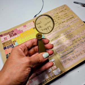 5_ Open Heart (Corazón Abierto) by Andreina Davila  Image: Magnifying glass over diary text before covering it with paint
