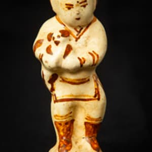 Untitled (Chinese Porcelain Figurine of a Boy Holding a Dog) by Artist Unknown