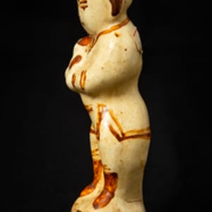 Untitled (Chinese Porcelain Figurine of a Boy Holding a Dog) by Artist Unknown 