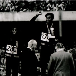 American athletes Larry James, Lee Evans and Ron Freeman (left to right) on the winner's podium for the 400-meter relay at the 1968 Olympic Games by Raymond Depardon