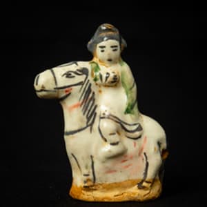 Untitled (Chinese Porcelain Figurine of a Horse and Rider) by Artist Unknown