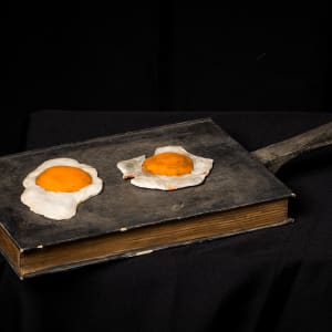 Untitled (Book with Frying Pan and Eggs) by Barton Benes