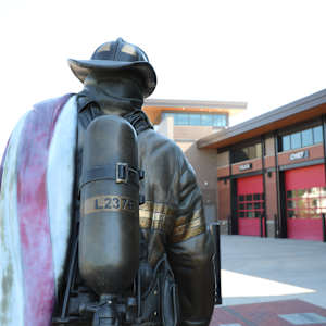 Never Forgotten by Austin Weishel  Image: Firefighter sculpture - from the back