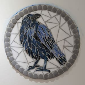 Blue Raven by Andrea L Edmundson  Image: Finished blue raven mosaic on wall