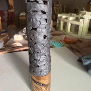 Small round black vase by Brandon Reese