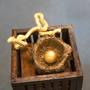 Eagle and a Golden Egg by Alan Powell  Image: gold leaf golf ball and tree root