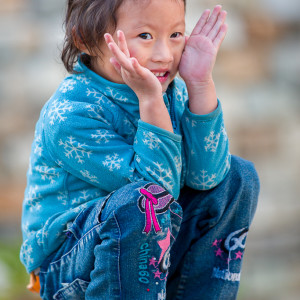 Girl in Blue (Thimpu, Bhutan) by Ron Cooper