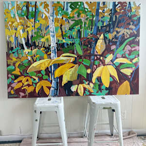 Early Fall by Krista Townsend  Image: The painting on two stools leaning against the studio wall.