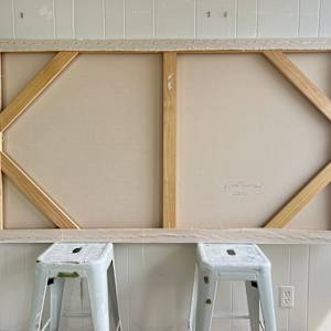 In Conversation With Trees by Krista Townsend  Image: The painting from the back showing stretchers with corner braces and a vertical cross bar.