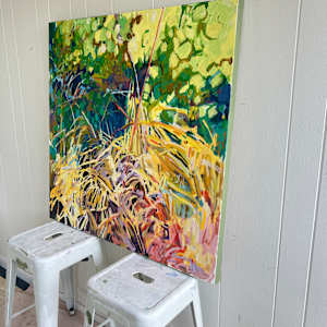 Microcosm by Krista Townsend  Image: The painting on two stools leaning against the studio wall pictured at an angle.