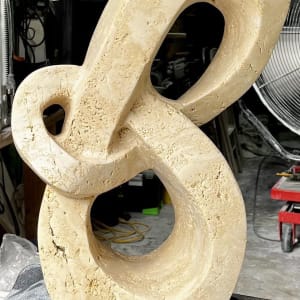Lover's Knot by Scott Gentry Sculpture  Image: "Lover's Knot" in Roman travertine_front view in natural light
