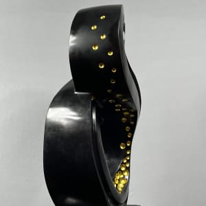 Lucky 8 by Scott Gentry Sculpture  Image: Scott Gentry Sculpture. "Lucky 8" left side view. Atlantic black marble with gold leaf on black granite base. Measures 31.5H x 13.5W x 12D inches.