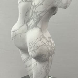 Dancing Muse by Scott Gentry Sculpture  Image: DANCING MUSE by Scott Gentry Sculpture. Carved from Calacatta marble and measuring 18.5Hx9Wx6D inches and placed atop a crystal base.