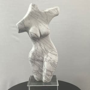 Dancing Muse by Scott Gentry Sculpture  Image: DANCING MUSE by Scott Gentry Sculpture. Carved from Calacatta marble and measuring 18.5Hx9Wx6D inches and placed atop a crystal base.