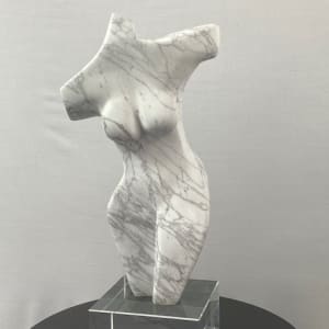 Dancing Muse by Scott Gentry Sculpture  Image: DANCING MUSE by Scott Gentry Sculpture. Carved from Calacatta marble and measuring 18.5Hx9Wx6D inches and placed atop a crystal base.