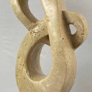 Lover's Knot by Scott Gentry Sculpture  Image: "Lover's Knot" by Scott Gentry Sculpture. Carved from Roman travertine and measuring 26Hx13Wx8D inches.