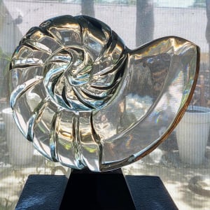 Nautilus II by Scott Gentry Sculpture  Image: Scott Gentry Sculpture. "Nautilus II" front view. Hand-poured and sanded glass on black glass base. Measures 13H x 14W x 5D inches.