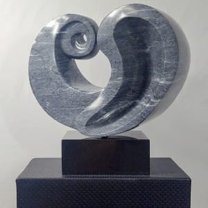 Opus II by Scott Gentry Sculpture  Image: Scott Gentry Sculpture. "Opus II" front view. Portuguese ravena azul marble on black marble base. Measures 18H x 18W x 9D inches.