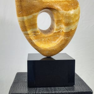 Persian Sunset by Scott Gentry Sculpture  Image: Scott Gentry Sculpture. "Persian Sunset" rear view. Persian yellow travertine on black marble base. Measures 15H x 7W x 7D inches.