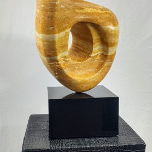 Persian Sunset by Scott Gentry Sculpture  Image: Scott Gentry Sculpture. "Persian Sunset" left rear view. Persian yellow travertine on black marble base. Measures 15H x 7W x 7D inches.