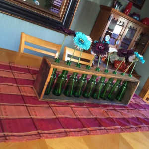 Pallet wood a bottles centerpiece by Heather Medrano 