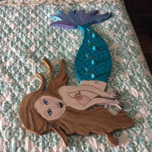 Hand cut and painted wooden mermaid hooks. by Heather Medrano 