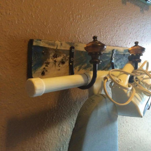 Pallet wood ironing board hooks by Heather Medrano 