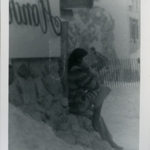 Untitled, (woman sitting on corner), c. 1969-73 by Dennis Hopper