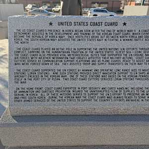 Korean War Memorial by Jerime Hooley  Image: Photograph by Jacob B. Arnell. Licensed by Creative Commons (CC BY-SA).
★ UNITED STATES COAST GUARD ★

The US Coast Guard's presence in Korea began soon after the end of World War II. A Coast Guard detachment assisted in the development and training of the Korean Coast Guard, which eventually became the Republic of Korea Navy. Once hostilities broke out between North Korea and South Korea, the South Korean Navy assisted the United States Navy in fighting a winning battle against the North.

The Coast Guard played an active role in supporting the United Nations (UN) efforts throughout the conflict, carrying on the humanitarian tradition of the United States' oldest sea—coinc service. The Coast Guard also provided vital meteorological duties that supported the UN ground, naval, and air forces with weather information that greatly affected their military actions. Coast Guard cutters served as communication support platforms and as plane guards, ready to assist aircrews who were forced down at sea. They assisted troop and supply transports on their way to Korea.

The Coast Guard supported the UN forces by manning and operating long-range aids to navigation stations (LORAN stations). Nine such stations provided direct navigation support to UN ships and aircraft engaged in the Korean War. One of these stations was based on the Korean Peninsula itself in the port city of Pusan. Two Coast Guard cutters serviced LORAN stations throughout the war.

On the home front, Coast Guard expertise in port security and cargo handling, including the loading of ammunition and sabotage prevention, insured the uninterrupted flow of supplies to the UN forces serving in Korea. All of these missions served to support the UN's effort to preserve an independent and free South Korea. During the Korean War, the Coast Guard was always ready to serve with the other armed services of the United States to support the country's efforts anywhere in the world.