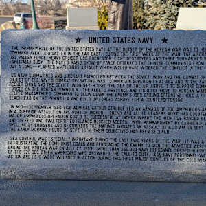 Korean War Memorial by Jerime Hooley  Image: Photograph by Jacob B. Arnell. Licensed by Creative Commons (CC BY-SA).
★ UNITED STATES NAVY ★

The primary role of the United States Navy at the outset of the Korean War was to help the UN Command avert a disaster in the Far East. During the first week of the war, the aircraft carrier USS Valley Forge, heavy cruiser USS Rochester, eight destroyers, and three submarines were especially busy. The Navy's rapid show of force deterred the Chinese Communists from carrying out a long-planned amphibious assault which would have widened the conflict in the Far East.

US Navy submarines and aircraft patrolled between the Soviet Union and the combat theater. The object of the Navy's combat operations was to maintain superiority at sea and in the Far East. As a result, China and the Soviet Union never used the sea or the air above it to support Communist forces on the Korean Peninsula. The fleet's presence and its quick move to Korean waters also helped MacArthur's command to slow down the enemy's 1950 ground offensive, hold a precarious beachhead on the peninsula, and build up forces ashore for a counteroffensive.

In mid-September 1950, Vice Admiral Arthur Struble led an armada of 230 amphibious and other ships in a surprise assault on the port of Inchon. Enemy and Allied leaders alike had doubted that a major amphibious operation could be successful at Inchon, where the high tide ranged between 23 and 35 feet and two fortified islands blocked access. With bombardment by carrier planes and shelling by cruisers and destroyers, the Marines initiated an assault at 6:30 AM on Sept. 15th. By the early morning hours of Sept. 16th, their objectives had been secured.

Sea control was especially important during the last two years of the war. It was a major factor in frustrating the Communist goals and persuading the enemy to sign the armistice agreement ending the Korean War on July 27, 1953. More than 265,000 Navy personnel served in Korea. A portion of the 720,000 other Americans who answered the call to duty, 465 Navy personnel were killed in action, and 1,576 were wounded in action during this first major conflict of the Cold War era.