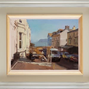 Looking down  sun bleached street to The Little Orme, Llandudno 