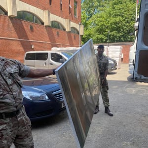 Trooping the Colour 2021 from Victoria Vestibule, Windsor Castle by Rob Pointon  Image: The regiment helping to transport the 2metre canvas from Windsor to Hyde Park Barracks
