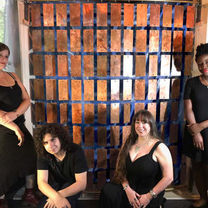 Etched Copper Room Divider for Superyacht's Main Saloon by Victoria Lansford  Image: The team during a test hanging prior to patination and pigment. Pictured left to right: Deanna Pastel, Skyler Lansford Hassan, Victoria Lansford, Uduak Ita