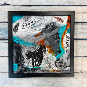 Dreams of Freedom  Image: ©Carolyn Bernard Young, Dreams of Freedom, 12 x 12 x .5″ mixed media on canvas, framed size 13.5 x 13.5 x 1.5″, in situ
