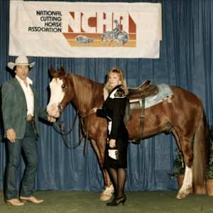 Baldy Freckles  Image: Baldy Freckles is pictured with Lee Garner at the NCHA World Championship. 