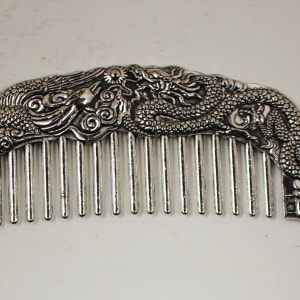 Dragon and pearl metal comb 