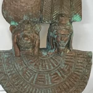 Heads of  Shu and Tefnut on a percussive instrument, a menat 