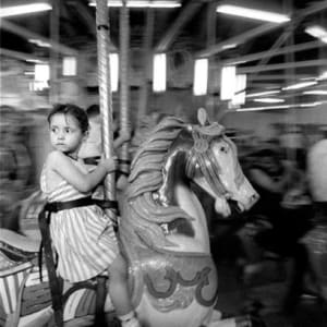 Gypsy Girl with Merry-Go-Round, Coney Island, NY, from Photographer's Choice: Harold Feinstein-Decades Four by Harold Feinstein