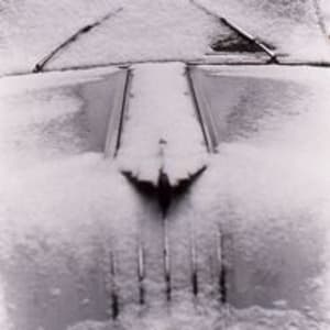 Car In Winter, Seventh Avenue, N.Y.C. by Louis Stettner