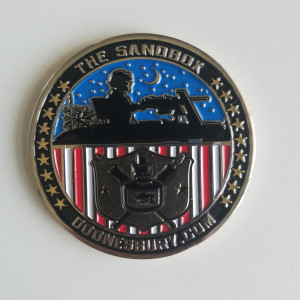 "Lighting up bad guys since 1970" -- Challenge medal by Garry Trudeau 