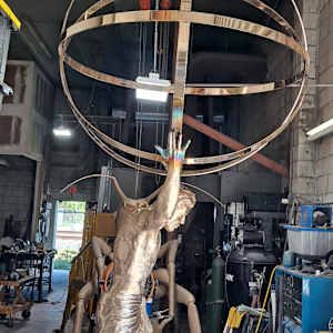 MAN WITH SPHERE-HALF LIFE SIZE by JACINTHE LACROIX. MASTER SCULPTOR AND ARTIST 