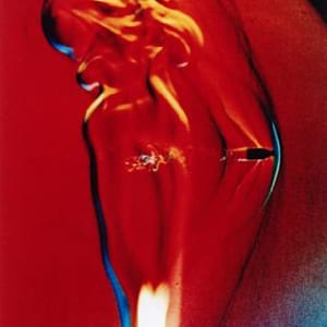 Bullet through candle flame by Harold Edgerton