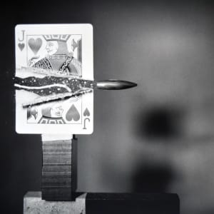 Bullet cutting card by Harold Edgerton